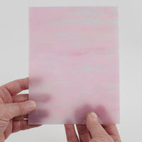 Video of the Ballet Pink glass plate in iridescent translucent pink, 15x19cm, held up and tilted to show its pattern and transparency