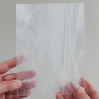 Video of the ice glass plate in semi-transparant white , 15x19cm, held up and tilted to show its pattern and transparency