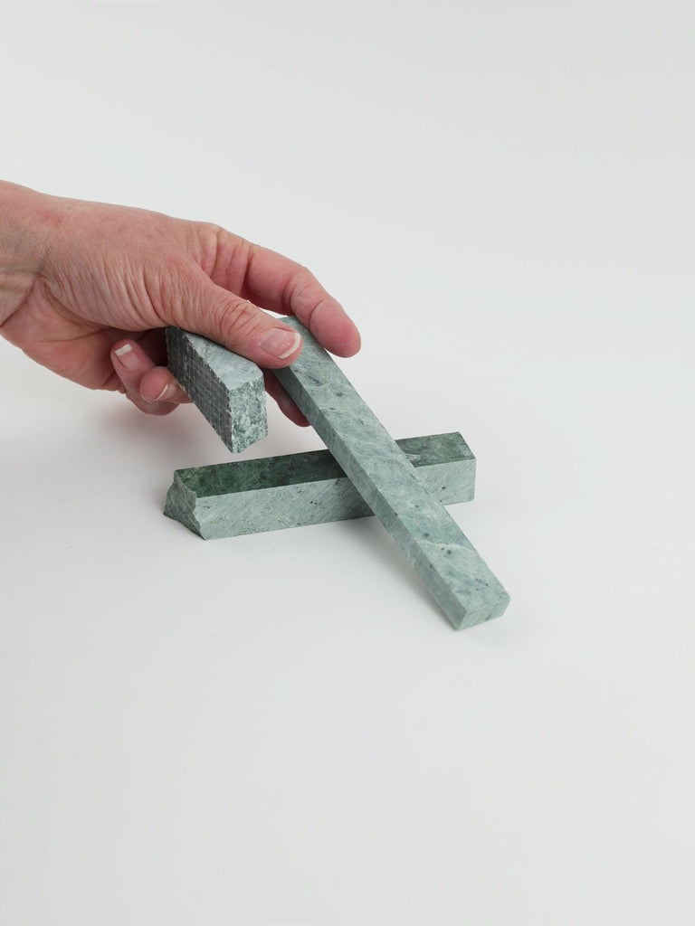 Video of Marble Bars XL Verde Jade in opaque green natural marble, 1–20 cm long and 8 mm thick, picked up by hand and turned to show their length, colour and natural veining